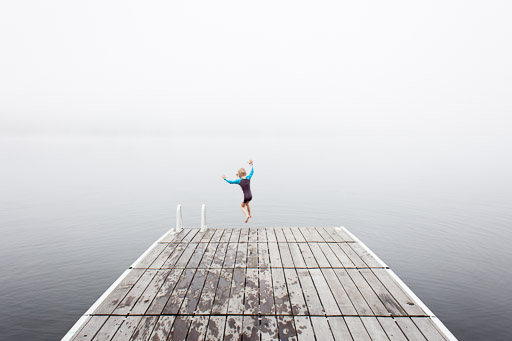 misty morning lake little boy misty morning lake little boy