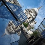 Photographs showcasing strong symmetrical compositions, with balanced shapes, lines, and reflections that create a sense of harmony and visual order.