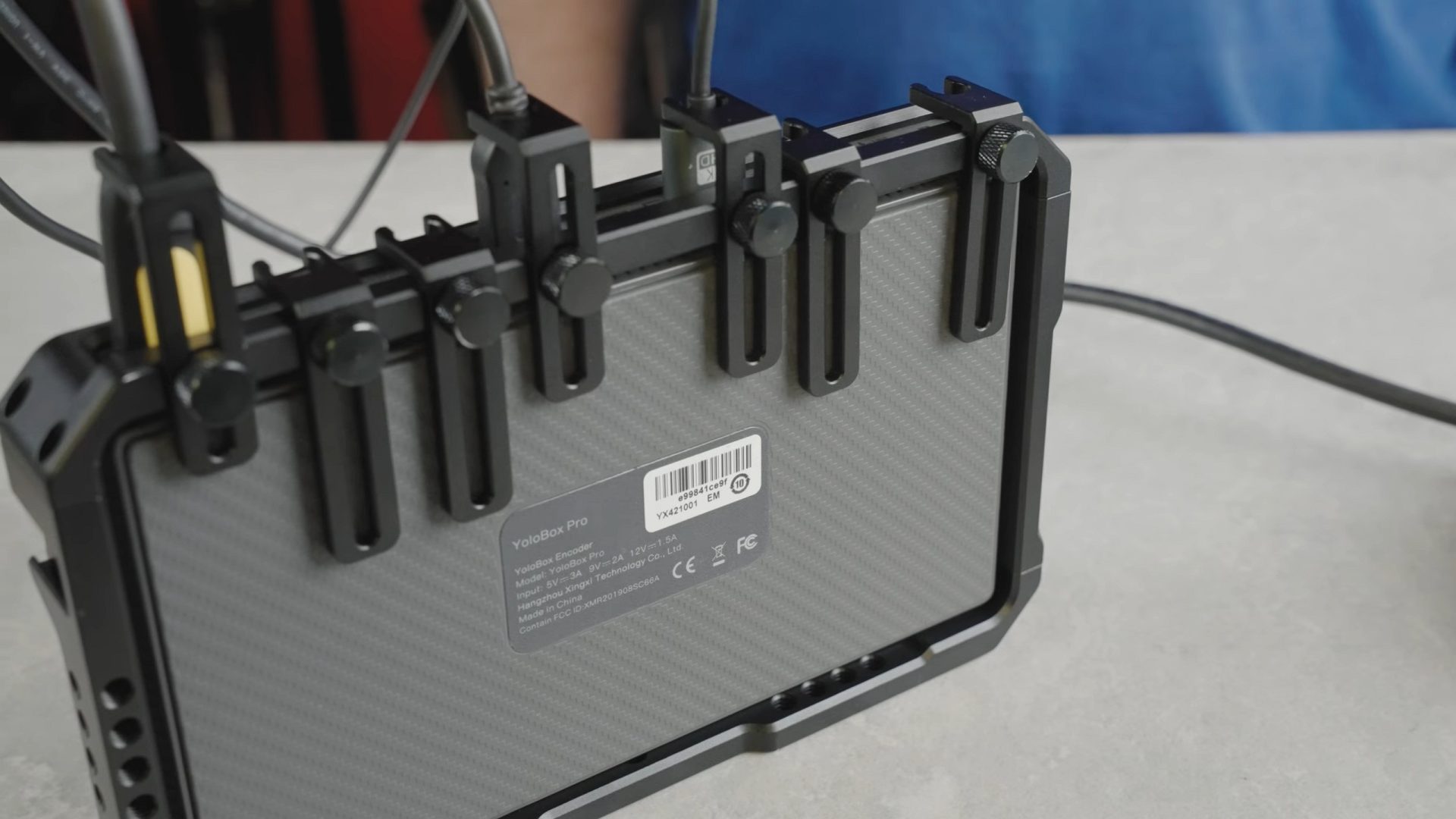 Yolobox Pro vs Feelworld l2 vs ATEM mini Pro - The YC onion cage ads mounting ports and cable guards