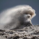 Photographer captures dramatic human face in wave on the Great Lakes