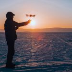 Fly drone in the snow tips