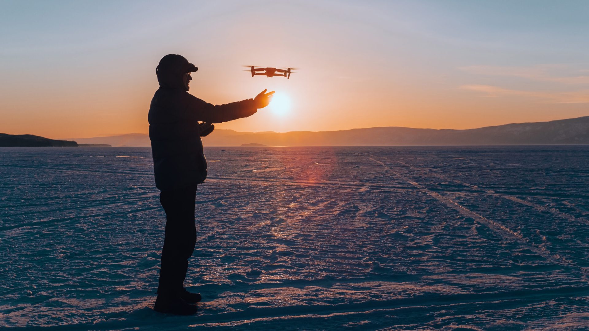 Fly drone in the snow tips