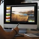 Man editing photos on a computer