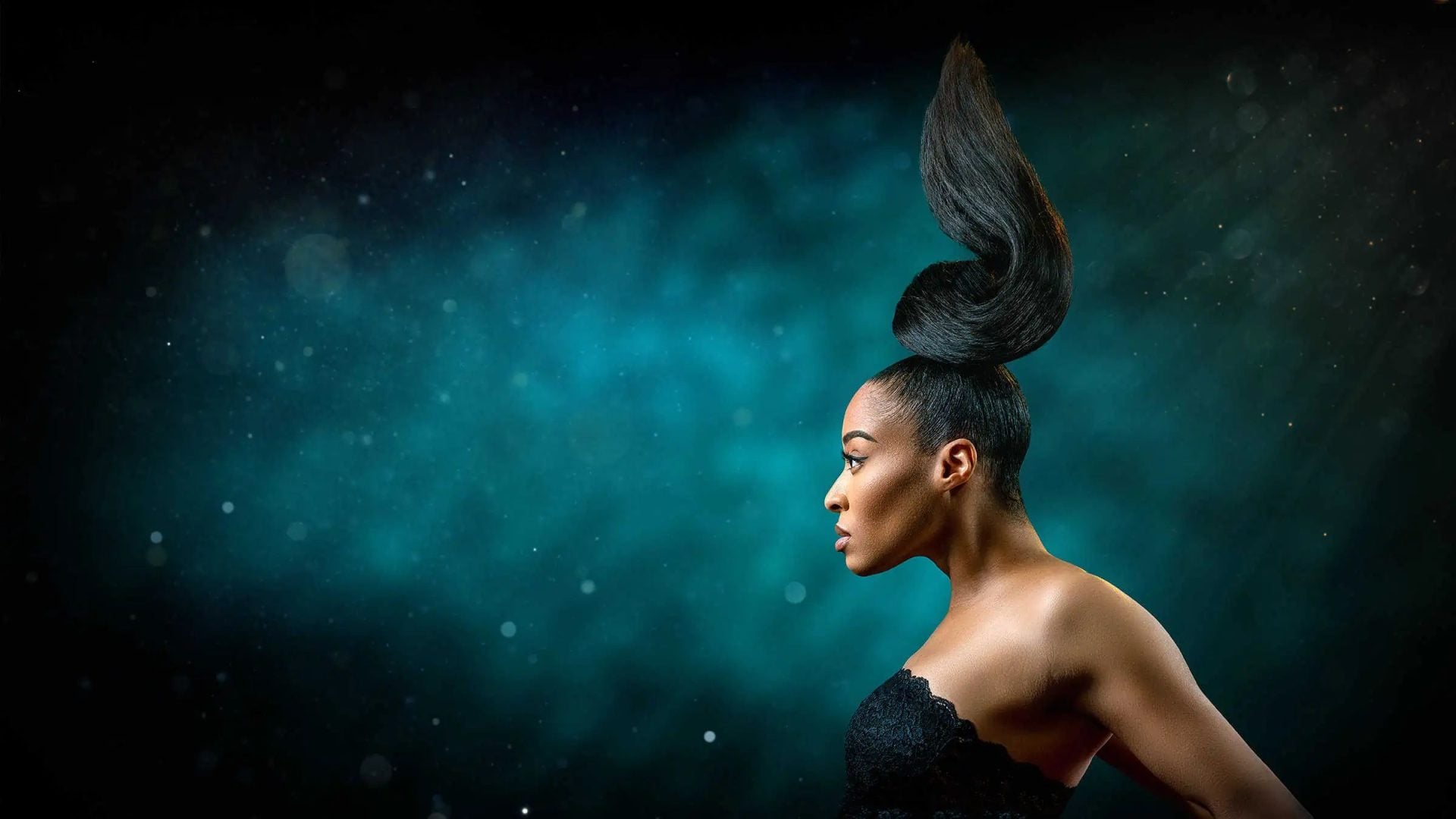 Beauty Portrait with Gravity Defying hair cyan background