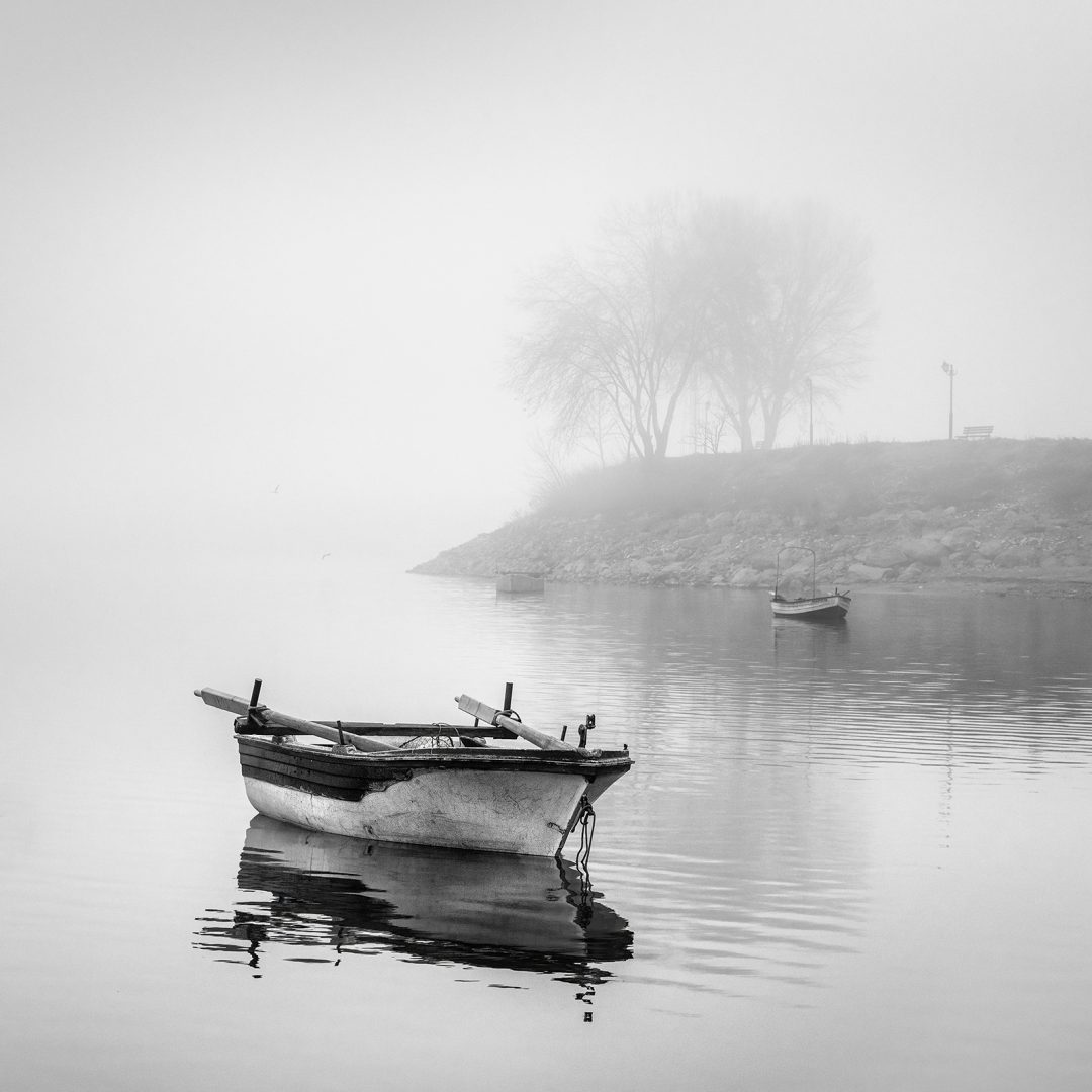 George Digalakis black and white boat next to shore