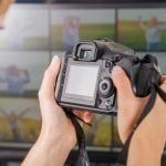 Freelance photographer woman at home office editing photos, blan