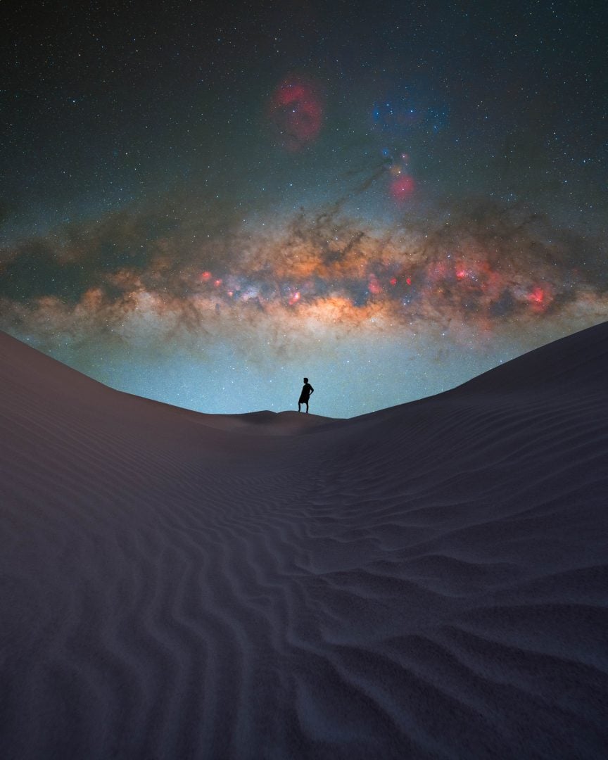Person with a galaxy view in the background