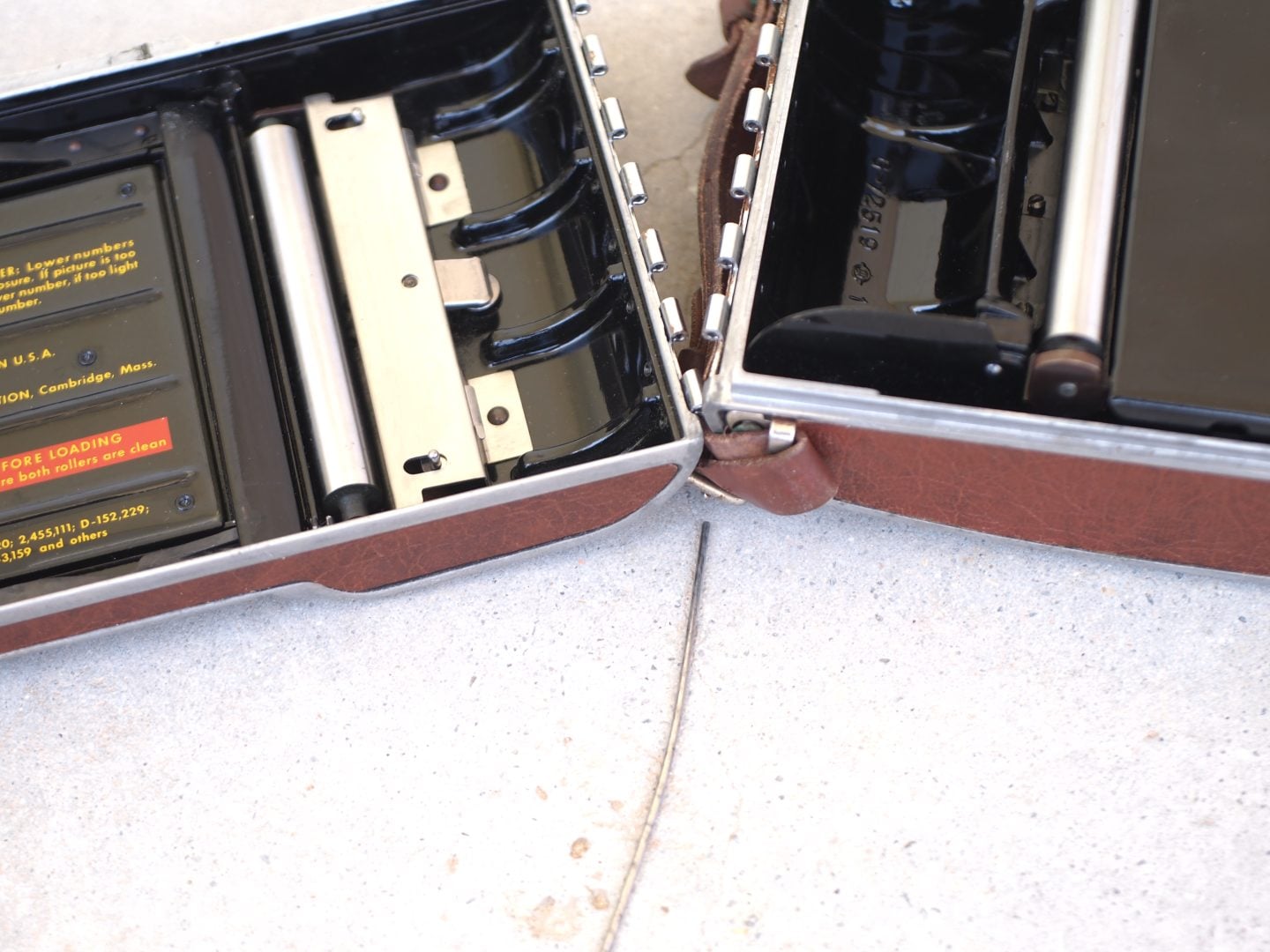 Figure 3. Pull out the two hinge pins to remove the roll film backs from the Model 95.