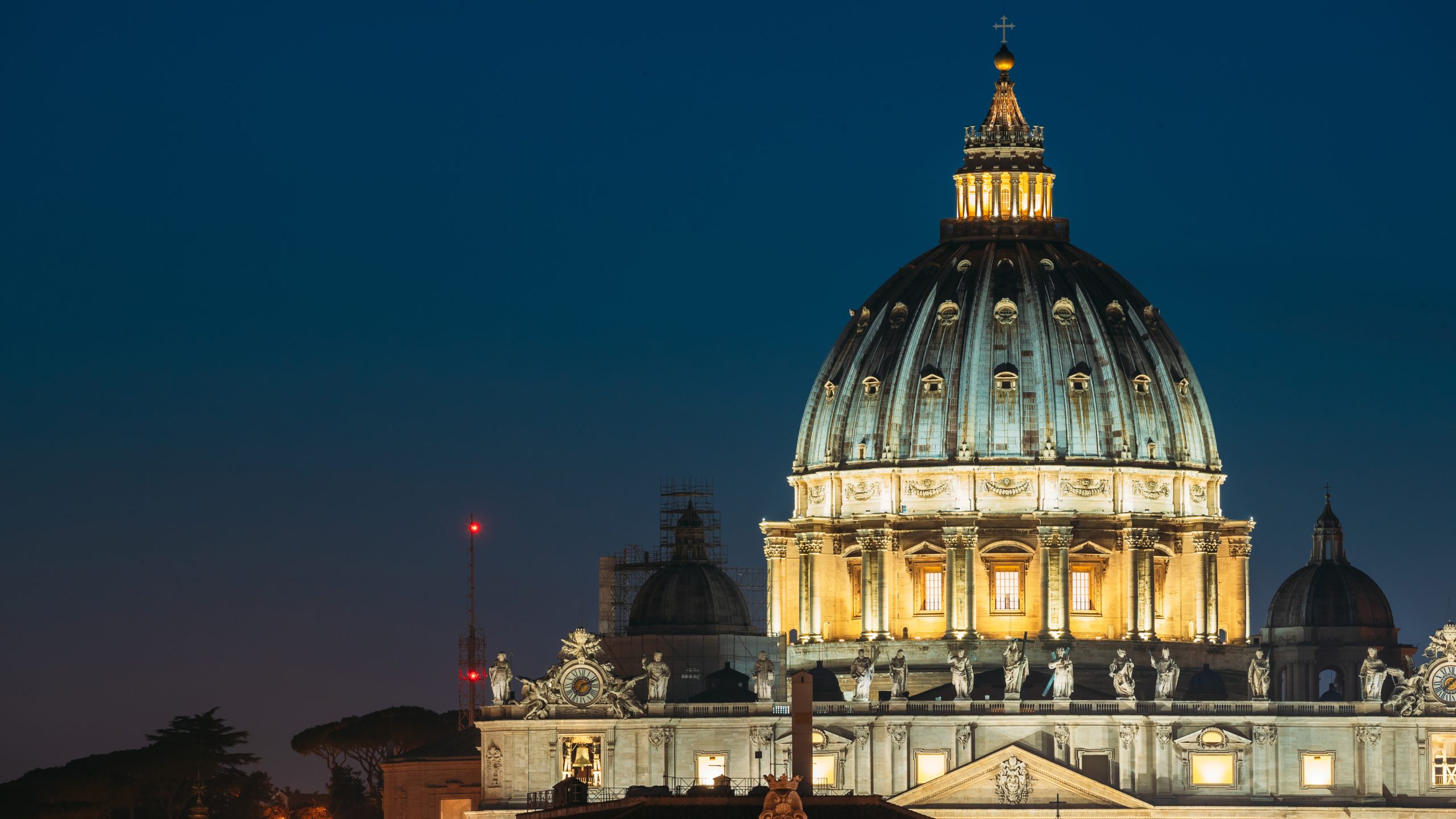 Rome, Italy. Close Up View Dome Of Papal Basilica Of St. Peter In Vatican In Evening Night Illuminations.