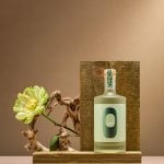 Clean minimalist product photography of Oishii sake bottle showcasing simple composition and elegant styling for beverage photography