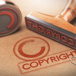 3D illustration of two rubber stamps with copyright word and symbol over kraft paper background, Concept of copyrighted material