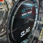 A technician sits beside the 3,200-megapixel camera at the Vera C. Rubin Observatory, the world’s largest digital camera for astrophotography.