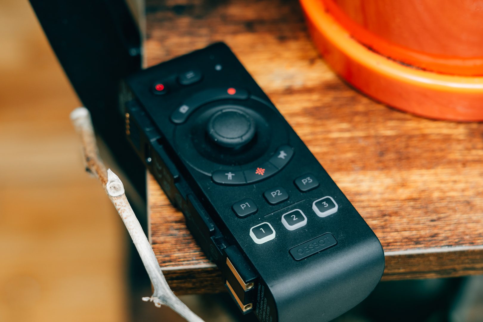 The OBSBOT Tail 2 is compatible with the pictured OBSBOT Bluetooth controller. 