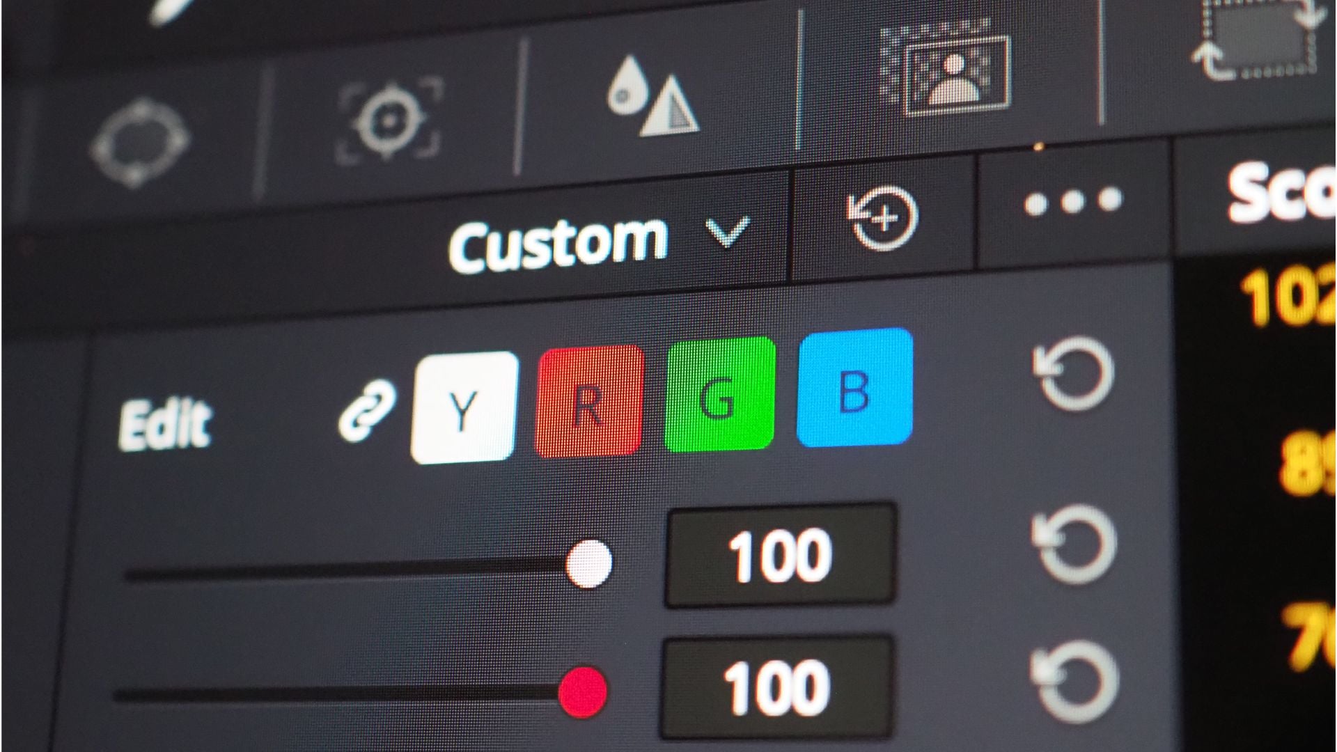 A detailed shot of a video editing software interface, where RGB sliders for adjusting red, green, and blue channels are being used to correct colors in the image.