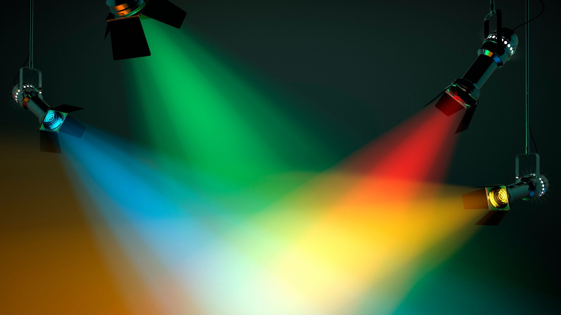 Spotlights casting colorful beams of light (green, blue, and red) across the stage, highlighting the impact of different color temperatures in visual media.