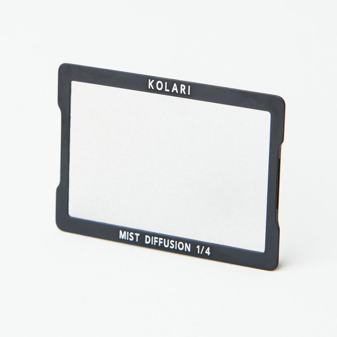 Kolari magnetic clip-in filter with a clear diffusion glass, "KOLARI" printed at the top and "MIST DIFFUSION 1/4" on the bottom
