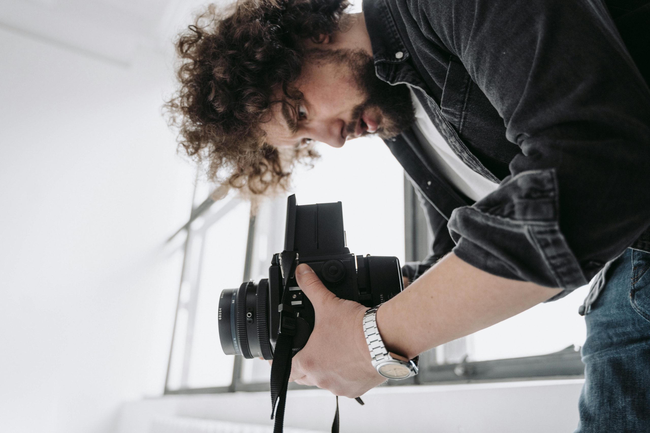 A man taking picture of a room interior