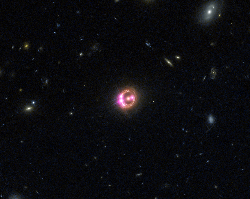 Chandra and Hubble's image of RX J1131-1231. Credit: X-ray: NASA/CXC/Univ of Michigan/R.C.Reis et al; Optical: NASA/STScI