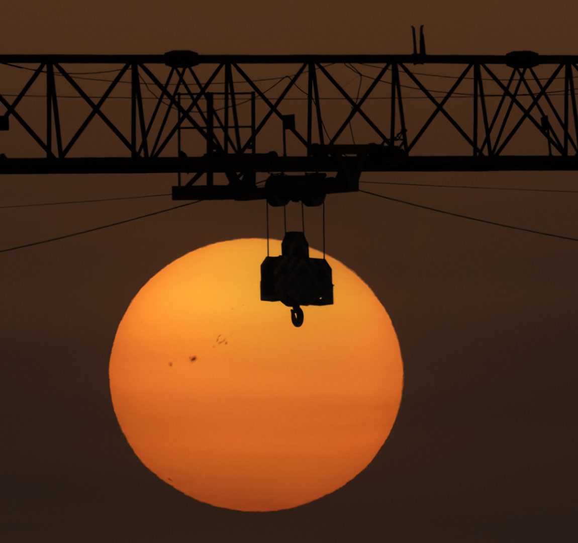 Sunspots appear as dark spots on the solar surface