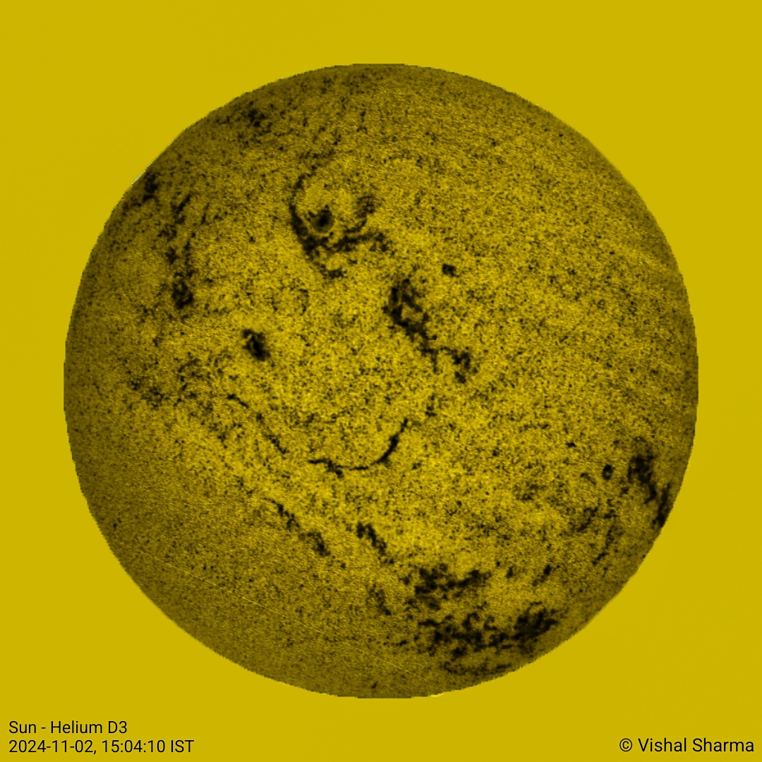 This image reveals the Sun in a different light. The helium D3 line, observed at 587.6 nm, highlights certain magnetic activities and structures on the Sun's surface that are not as prominent in the typical H-alpha images, which are taken at 656.3 nm. Credit: Vishal Sharma