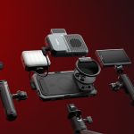 Complete mobile photography kit featuring phone case, lens attachments, stabilizing grips, and various mounting accessories arranged against red gradient background.