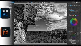 Professional photo editing workspace showing dramatic black-and-white landscape with cliffs and clouds, featuring DxO software tools and color adjustment panels.