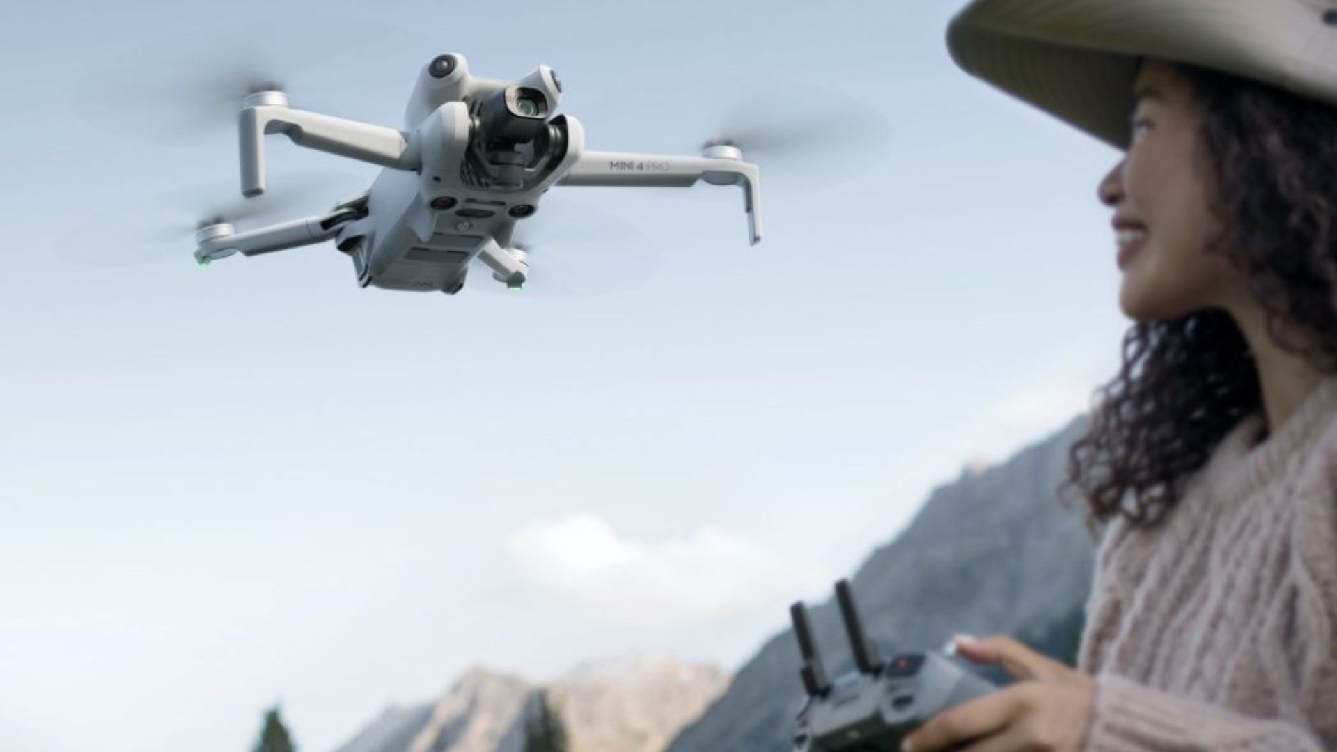 Woman Operating DJI Mini 4 Pro Drone with Remote Controller