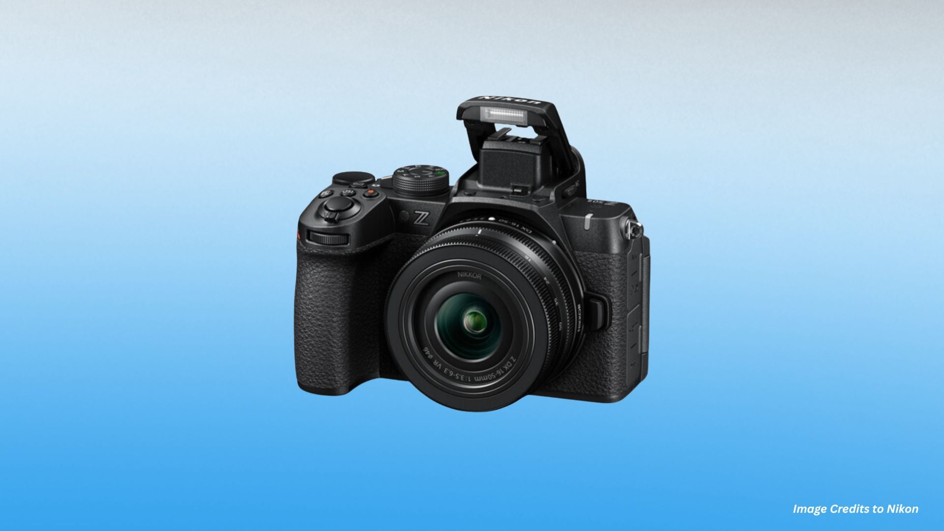 Black Nikon Z mirrorless camera with raised built-in flash unit and wide-angle zoom lens attached