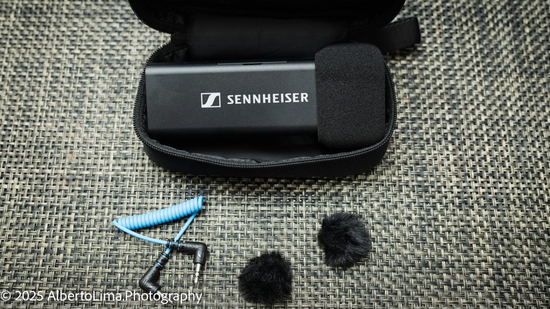 The Sennheiser Profile Wireless Mic System including charging base, pouch, windscreen attachments, and TRS cable.