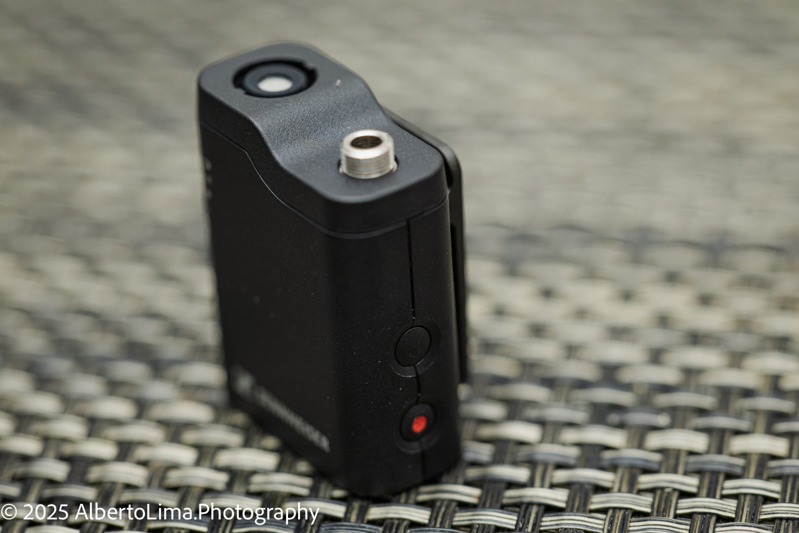 The Sennheiser wireless transmitter is shown with the power button and the REC button.