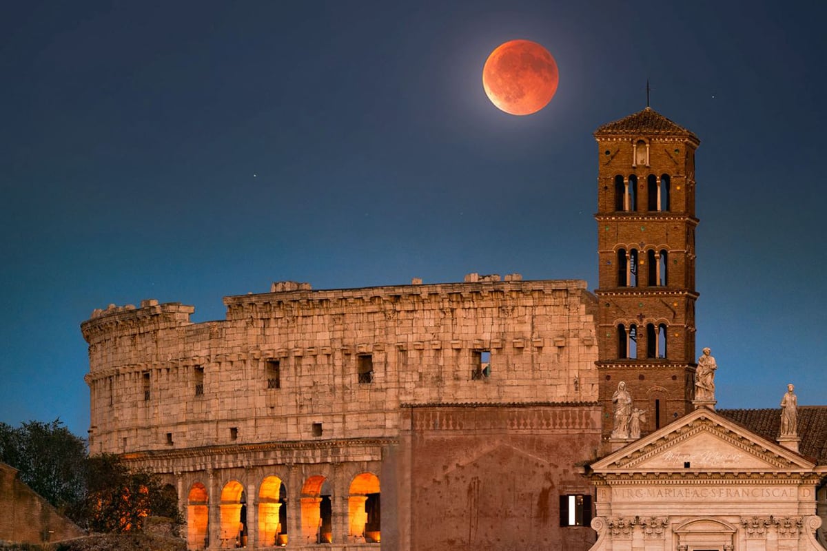 Marco Meniero photographed the blood moon over the Colosseum in Rome, Italy