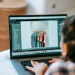 A person is using Adobe Lightroom to edit