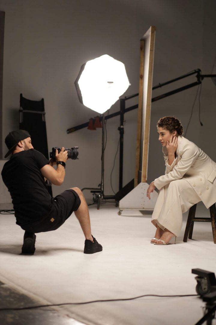 A man taking a portrait of a woman.