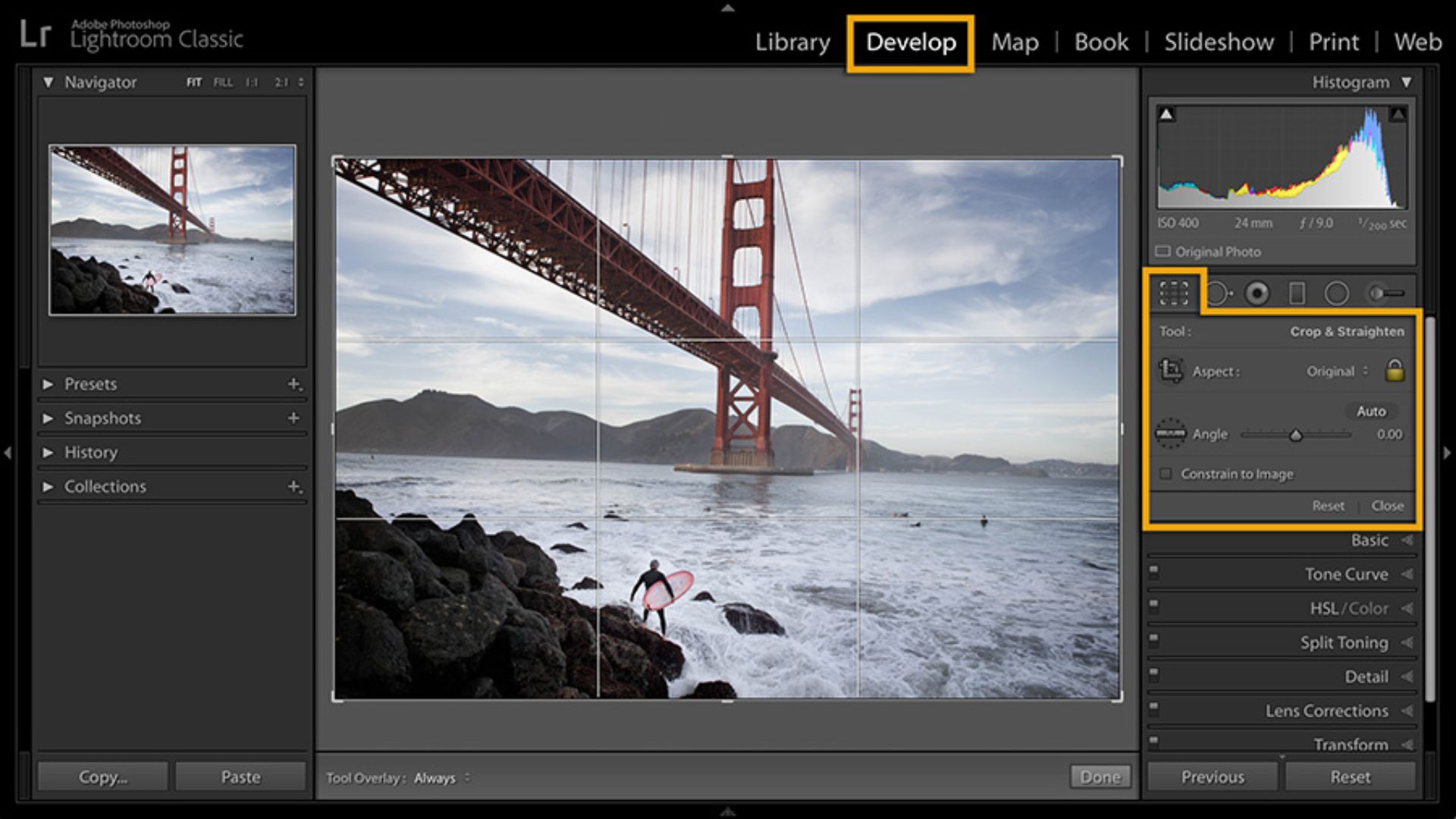 Lightroom Classic develop module showing Golden Gate Bridge photo with crop and straighten tool active, displaying grid overlay, histogram, and adjustment panels on right.