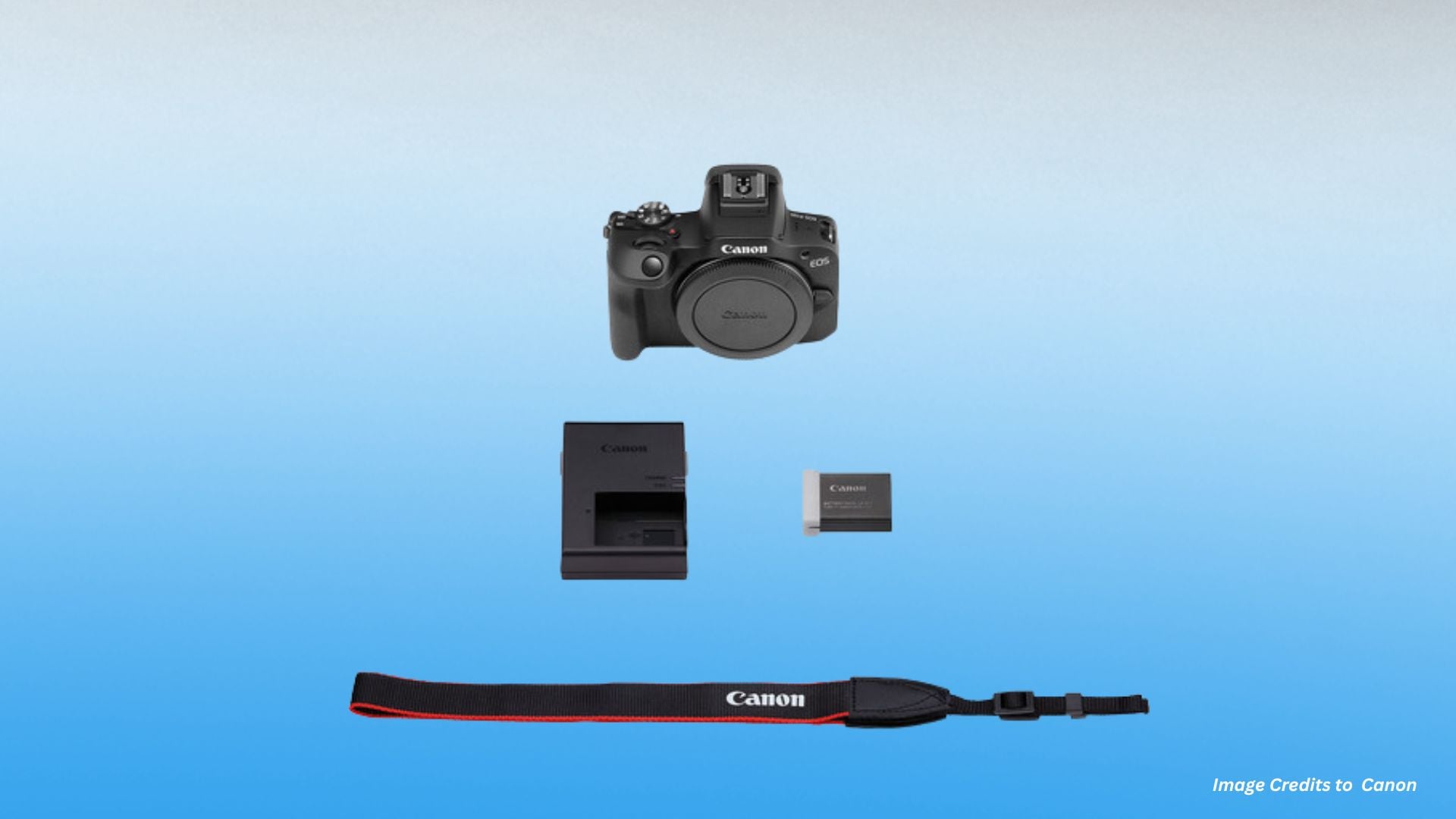 Flat lay of Canon EOS R100 kit contents including camera body with body cap, battery charger, rechargeable battery pack, and neck strap with Canon branding.