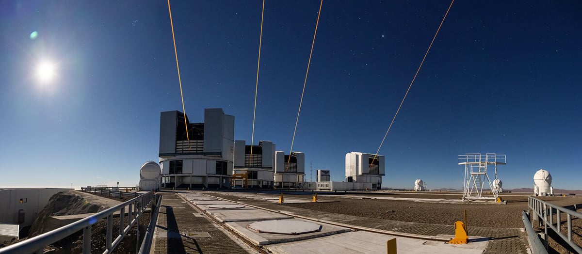 This photograph shows four lasers at ESO’s Paranal Observatory, each one launched from one of the four eight-metre telescopes on site. Credit: A. Berdeu/ESO