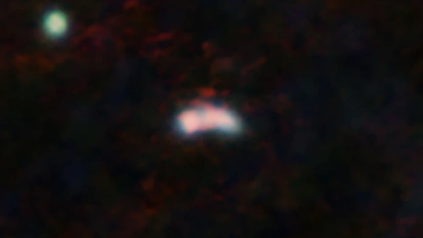 Galaxy Y1 and its surroundings as seen by the James Webb Space Telescope’s NIRCAM (blue and green) and by ALMA (red). Credit: NASA, ESA, CSA (JWST), T. Bakx/ALMA (ESO/NRAO/NAOJ)