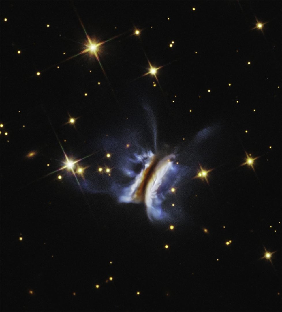 This Hubble Space Telescope image shows the largest planet-forming disc ever observed around a young star. It spans nearly 640 billion kilometers, roughly 40 times the diameter of our Solar System. Credit: NASA, ESA, STScI, K. Monsch (CfA). Image processing: J. DePasquale (STScI).
