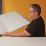 A step-by-step guide to creating a DIY V-flat, an essential tool for photographers to shape and control light in the studio, enhancing your shooting setup.