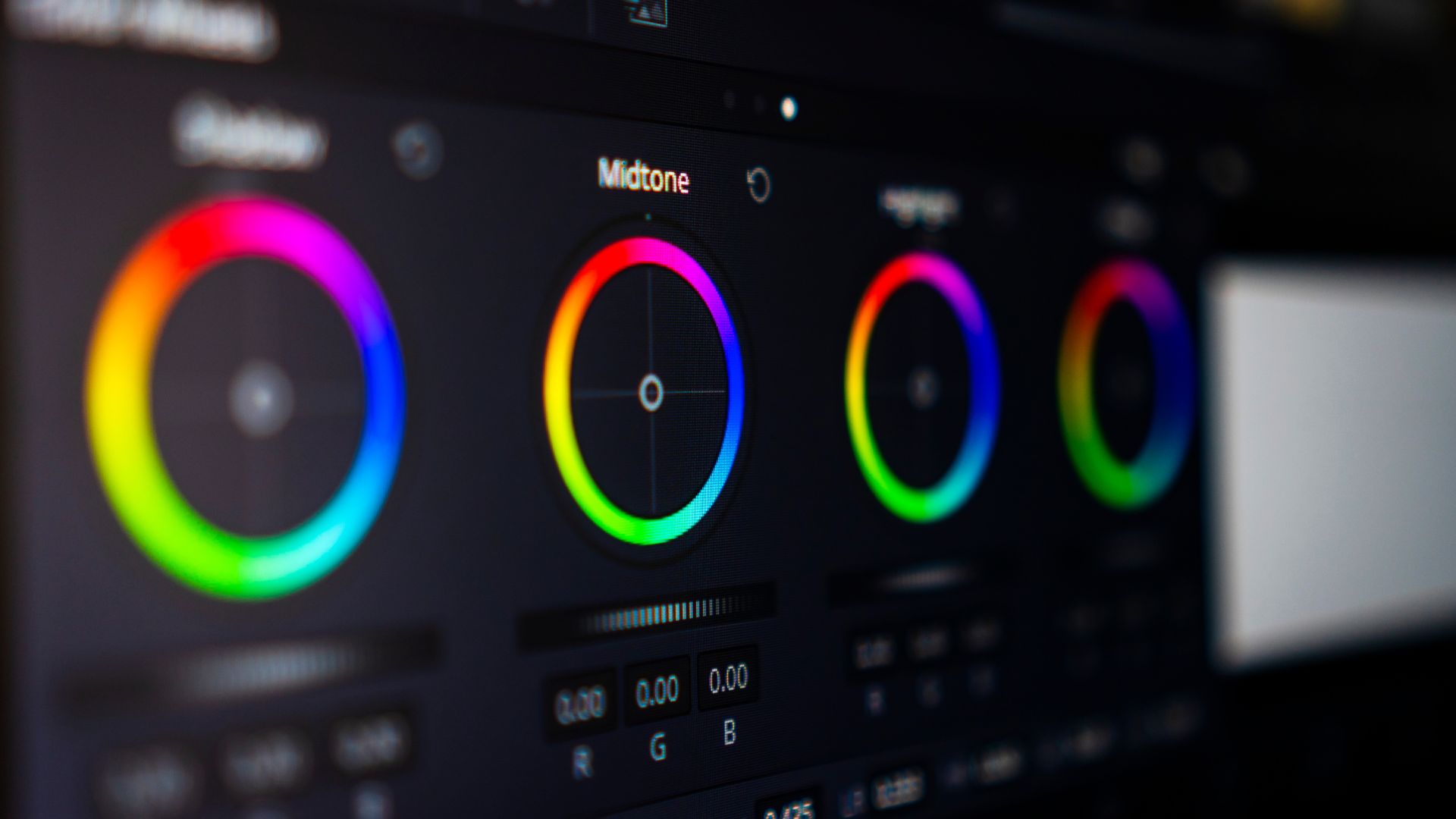 Photo editing software displaying four color wheels with rainbow gradient rings for adjusting midtones and color balance in post-processing workflow