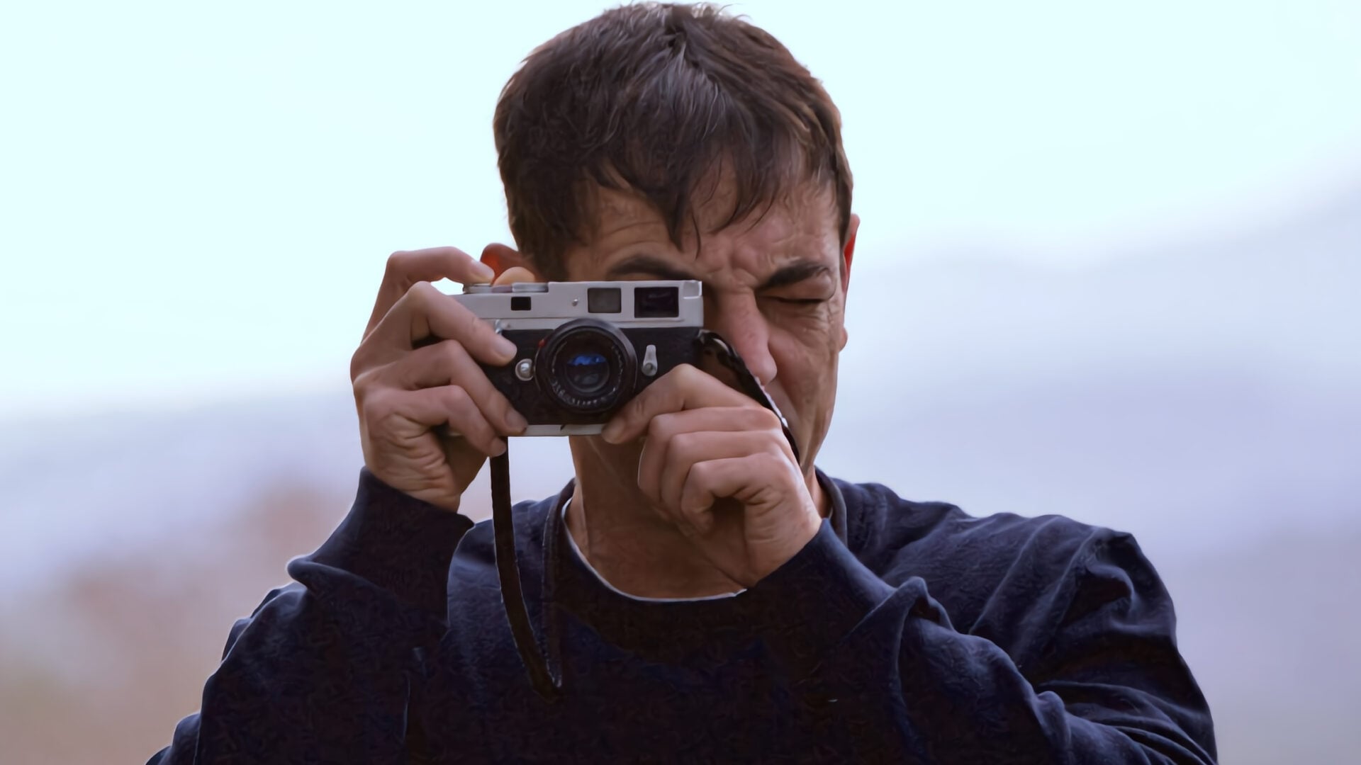 Vincent Tantardini holding a vintage camera