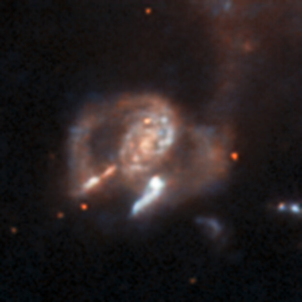 The strange galaxy seen here is certainly anomalous, with its compact, swirling core and two open lobes at the sides. Exactly what kind of galaxy it is is unclear, and it was not previously known to astronomers. Credit: ESA/Hubble & NASA, D. O’Ryan, P. Gómez (European Space Agency), M. Zamani (ESA/Hubble)