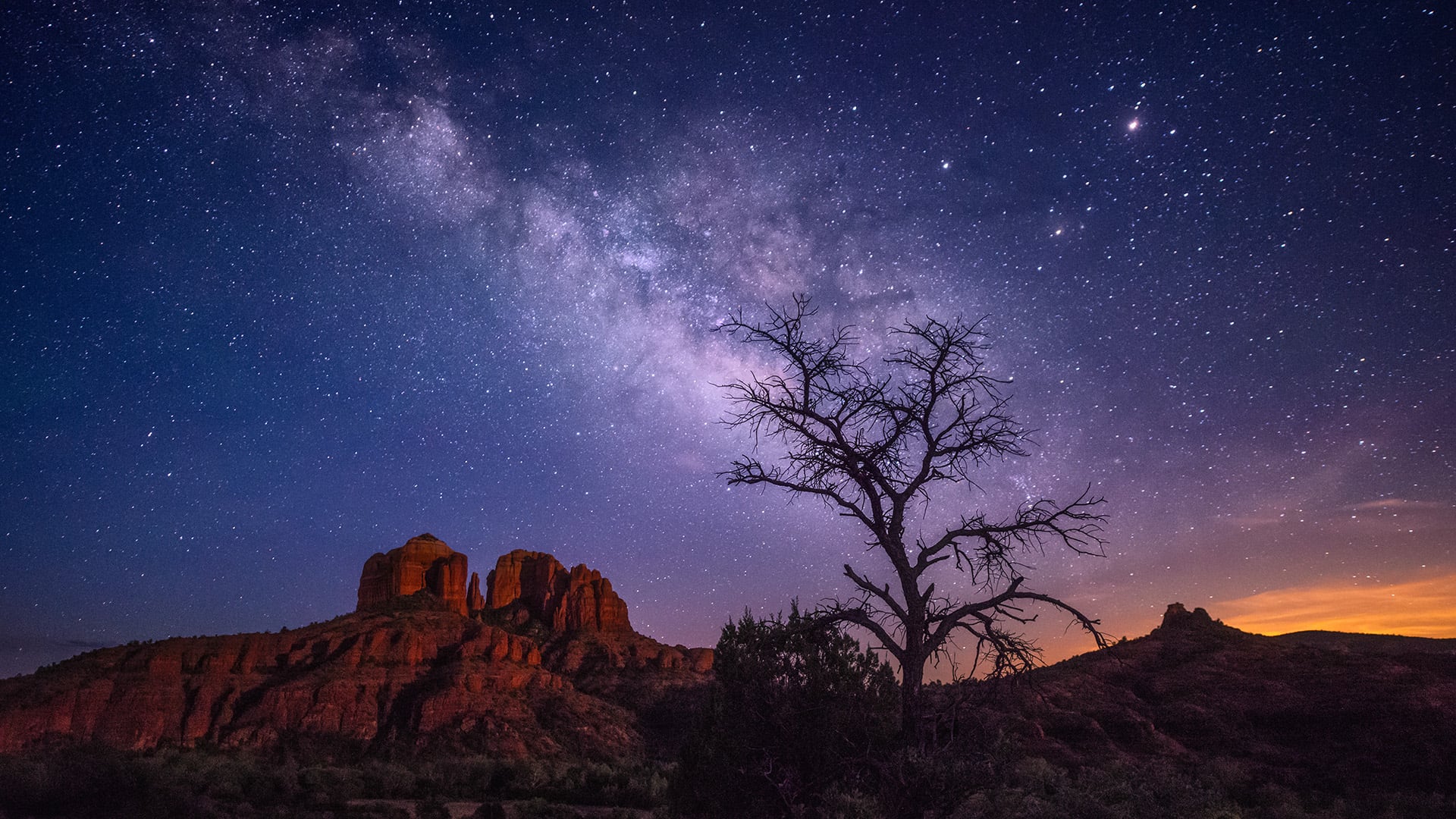 A beautiful shot of the Cathedral Rock under the stars, Milky Way on the night starry sky