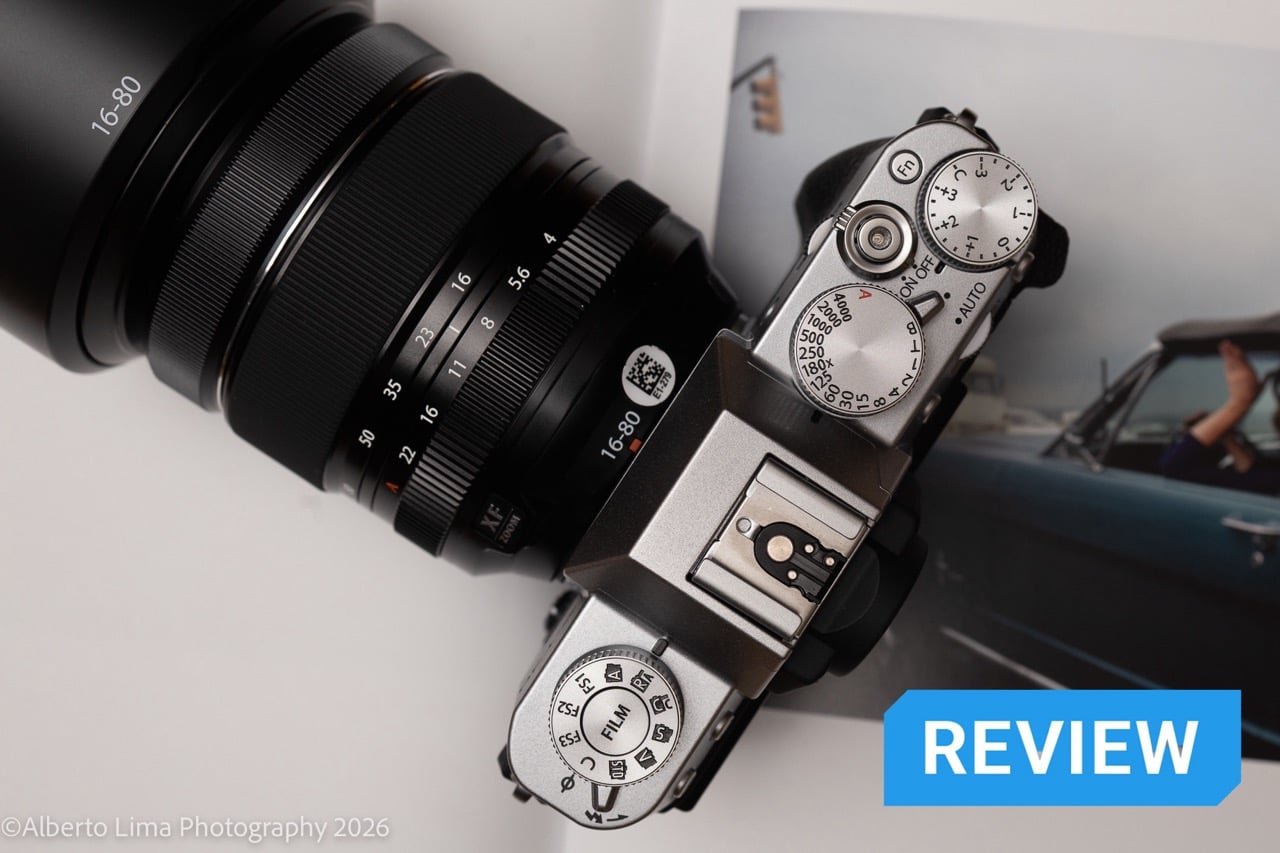 A Fujifilm X-T30 III sits on top of a photobook.