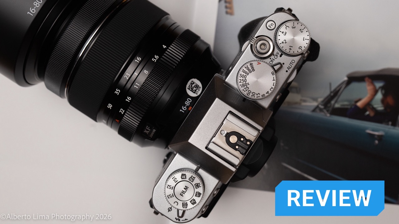 A Fujifilm X-T30 III sits on top of a photobook.