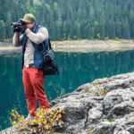 Man with the camera at the lake