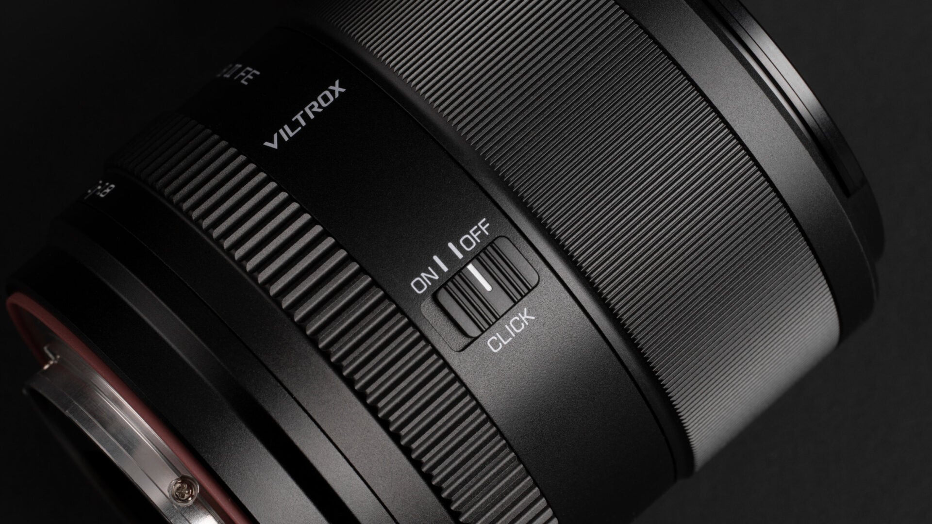 A close-up of a Viltrox Lens with the Click On-Off Switch and detailed of the control rings.