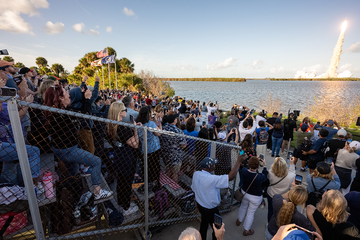 Guests at the Banana Creek viewing site watch the launch of NASA’s Space Launch System (SLS) rocket and Orion spacecraft. Credit: NASA/Keegan Barber