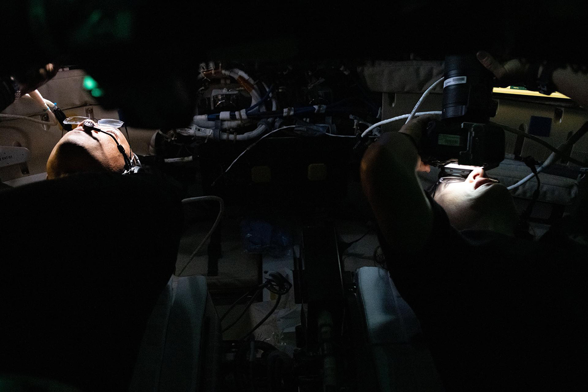 Artemis II Pilot Victor Glover, on the left, and Mission Specialist Christina Koch, on the right, gather images and observations of the lunar surface to share with the world during the lunar flyby on the sixth day of the mission. Credit: NASA
