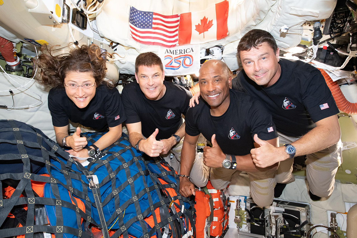 The Artemis II crew – (from left) Mission Specialist Christina Koch, Mission Specialist Jeremy Hansen, Pilot Victor Glover, and Commander Reid Wiseman – pause for a group photo inside the Orion spacecraft on their way home. Credit: NASA